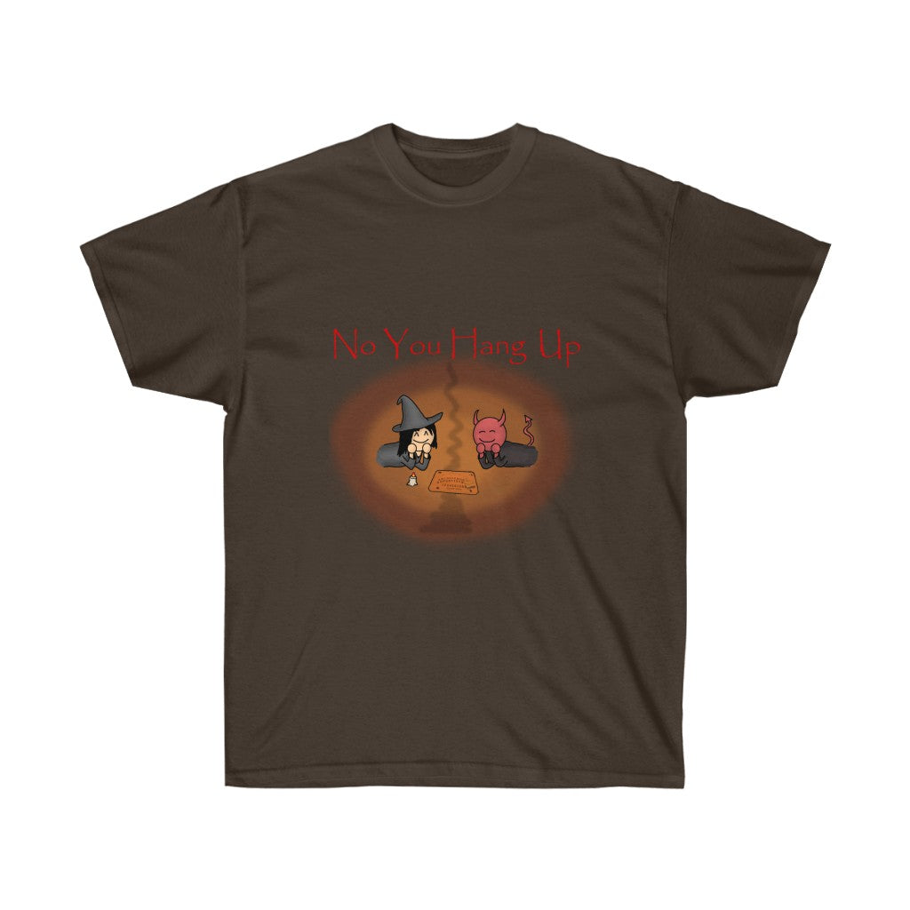 A dark brown shirt with red text saying "No you hang up". The graphic on the shirt is depicting a witch and a demon talking via a Ouija board. There's a reddish orange and orange circle around the graphic.