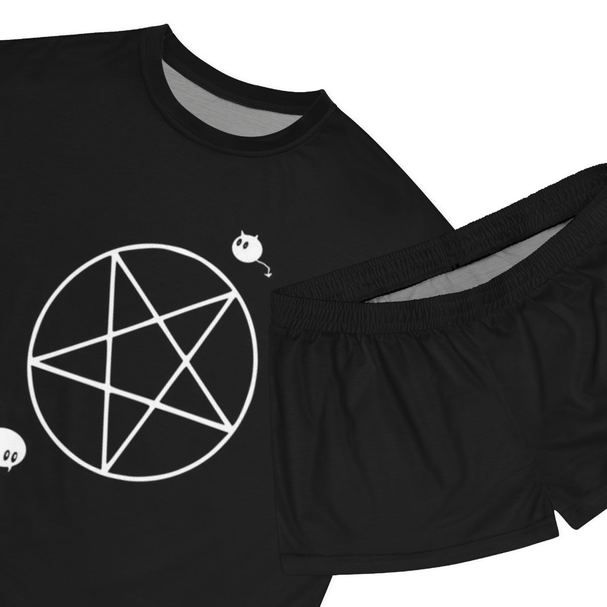 A close up of a black pajama shirt and black pajama shorts. The shirt has an upside down pentacle with a mouse in the bottom left corner and a chibi cat demon in the upper right corner.