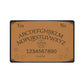 A brown ouija board mat with a black boarder. There's a pentacle in the middle.