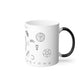A white mug with a black handle sitting on a white background. On the mug is an assortment of alchemical symbols, including a half moon, a pentacle, the symbol for mercury, zodiac signs along the bottom, etc.