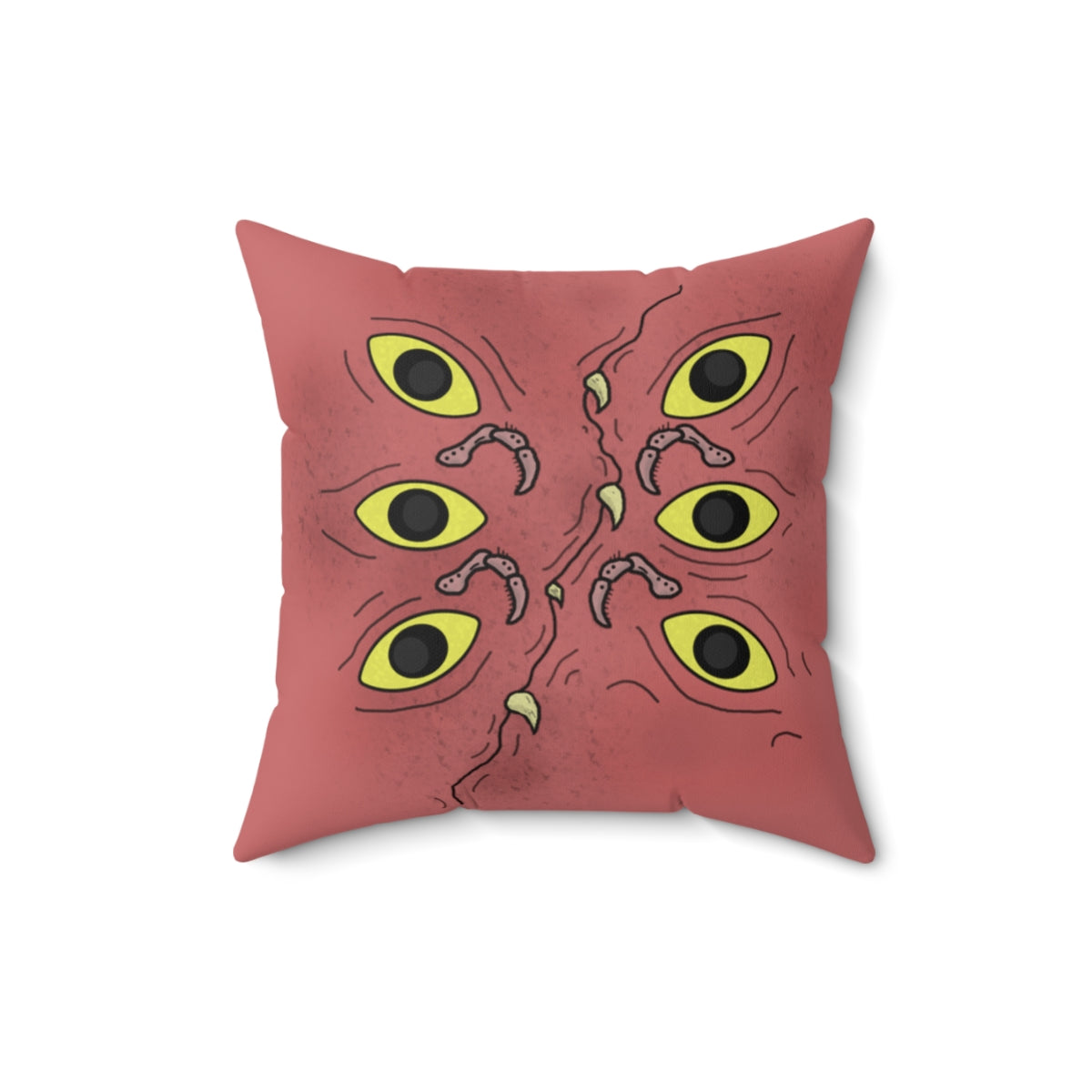 A dark pink throw pillow with specs of black designed to make it look a little dirty. It's stylized to look like a ghoulish mimic. It has 6 eyes, 3 on each side, multiple legs akin to a hermit crab (Segmented with hairs on them, curving at each segment), and a curved "mouth" going through the center with multiple teeth popping out.