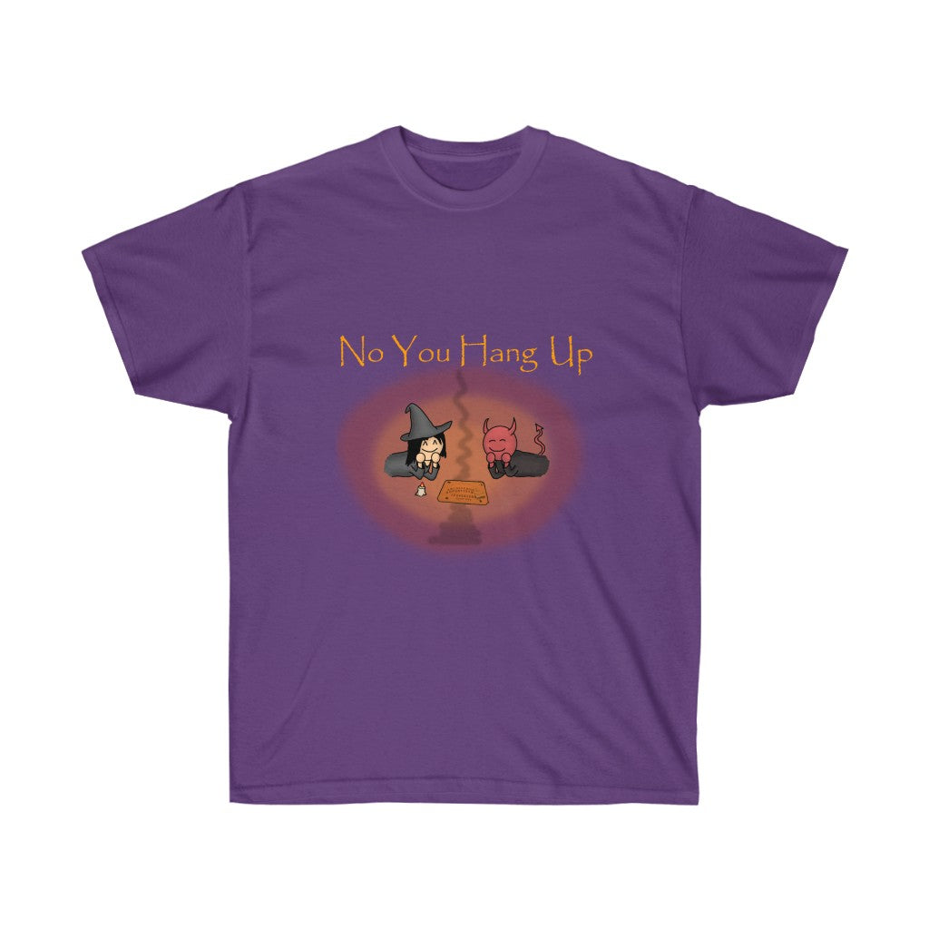 A purple shirt with golden text saying "No you hang up". The graphic on the shirt is depicting a witch and a demon talking via a Ouija board. There's a reddish orange and orange circle around the graphic.