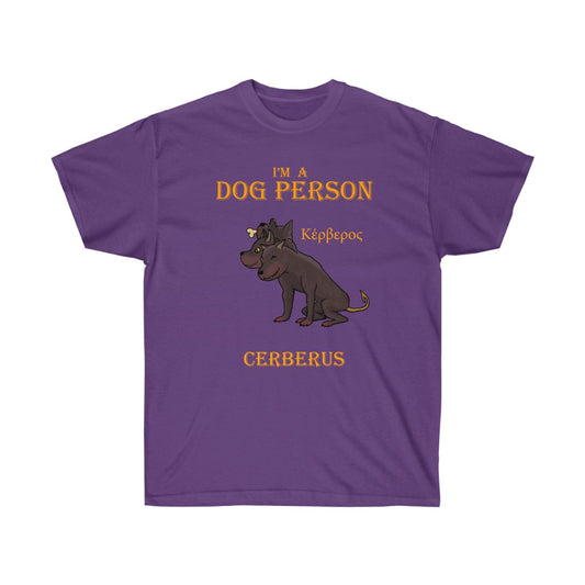 A purple shirt. It has a graphic of Cerberus in the middle. At the top, golden text reads "I'm a dog person." At the bottom, golden text reads "Cerberus." Beside the graphic is Cerberus in greek.