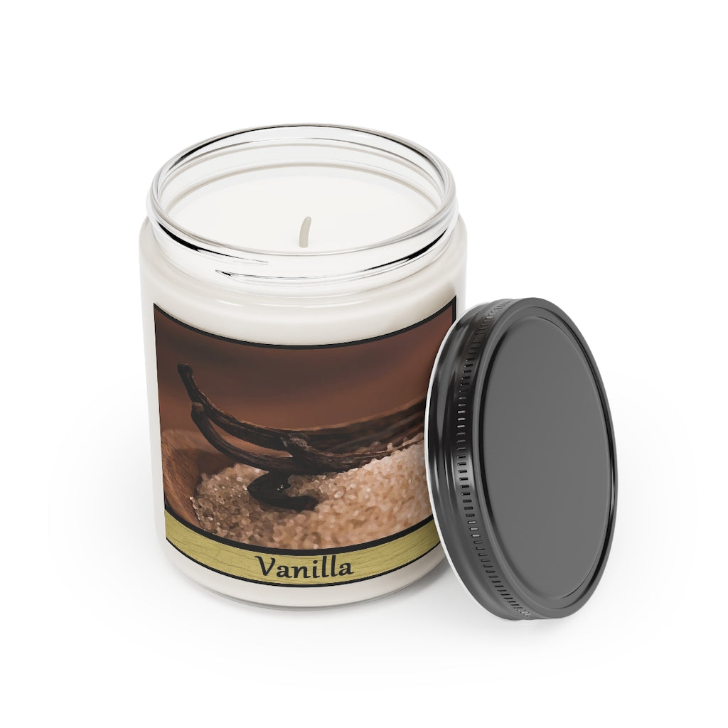 A vanilla candle sitting on a white background. The label features several sticks of cinnamon laying on top of salt in a wooden bowl. The words "vanilla" are below the picture. The lid has been removed and propped against the jar.