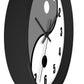 Side view of a gray and white yin and yang clock.