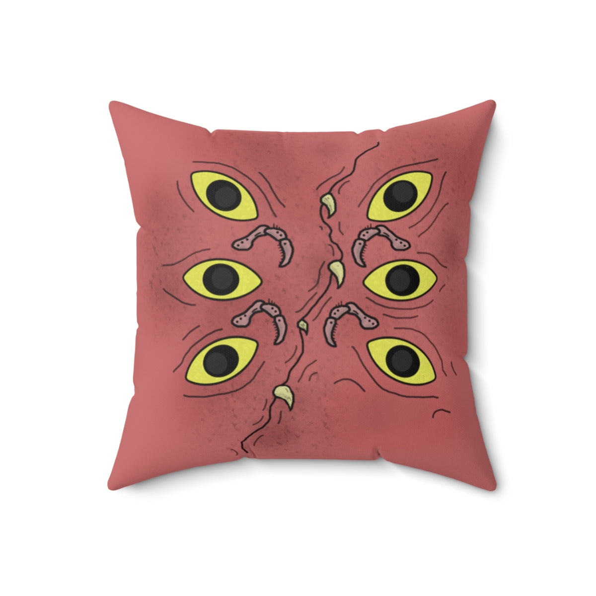 A dark pink throw pillow with specs of black designed to make it look a little dirty. It's stylized to look like a ghoulish mimic. It has 6 eyes, 3 on each side, multiple legs akin to a hermit crab (Segmented with hairs on them, curving at each segment), and a curved "mouth" going through the center with multiple teeth popping out.